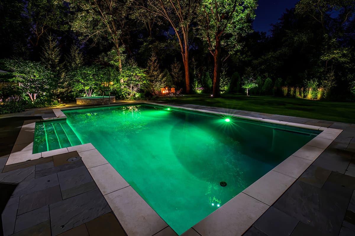 Sandblasted Valders Limestone Surrounds the Pool and Spa